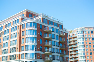 Fototapeta na wymiar Modern condo buildings with huge windows in Montreal, Canada.
