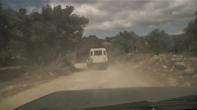 Safari car is passing through an off-road very fast