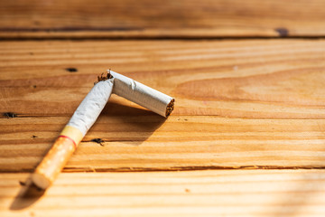 World No Tobacco Day, May 31. Close up Broken cigarette on wooden table background.