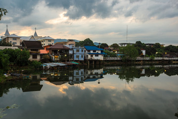 Fototapeta na wymiar Morning Sky (Niramon Bridge), waterfront community. Chanthaburi Province, Thailand