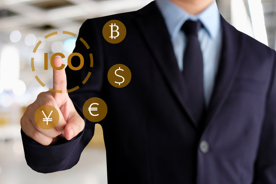 Businessman hand using smartphone with ICO, Initial Coin Offering, icon on a virtual screen. Cryptocurrency, Bitcoin and ICO Digital Electronic Trade Market Stock Index concept.