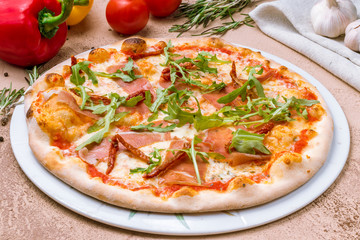 Pizza with Parma ham and arugula