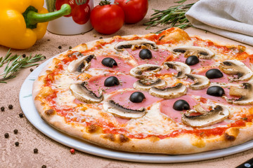 Pizza with ham and mushrooms