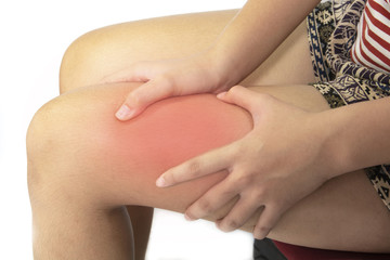 The girl thigh pain She is using a hand massage on her thighs.