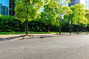 empty asphalt road and modern commercial office buildings in shanghai