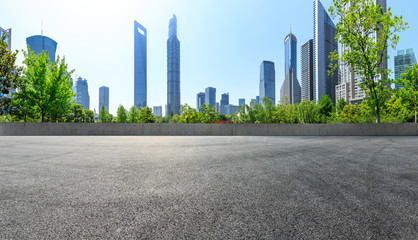 empty asphalt square road with city skyline background in shanghai