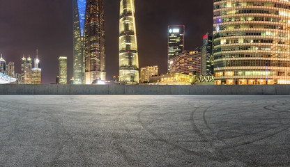 Fototapeta na wymiar asphalt square road and city skyline in shanghai at night