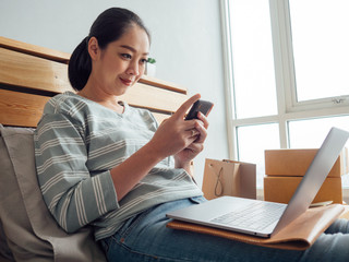 Happy woman online store owner receiving order from customer. Concept of online store digital business owner.