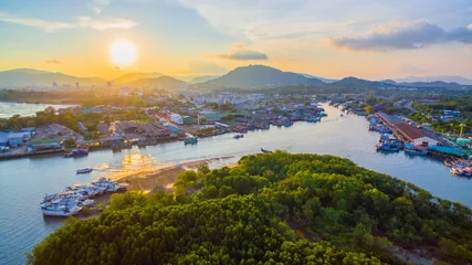 Photo sur Plexiglas Porte aerial view reflection of sunset at three junction canal near Phuket Fishing Port. Phuket Fishing Port is the largest fishing port. Located in Koh Siray Island, next to Phuket Island.