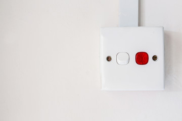 White wall socket on wall, unplug or plugged in concept.Vertical power electric plug outlet.