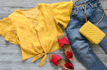 Womens clothing, accessories, shoes (yellow blouse in polka dot, blue jeans, leather red sandals, ...