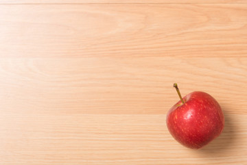 red apple on wood background