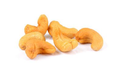 Roasted cashew nuts whith salt on white background