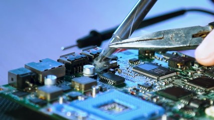 electronic workshop courses. motherboard soldering closeup. computer repair