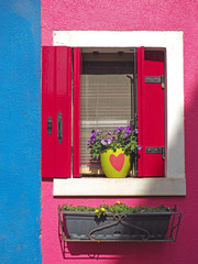 Burano, Venezia, Italy. Details of the windows of the colorful houses in Burano island