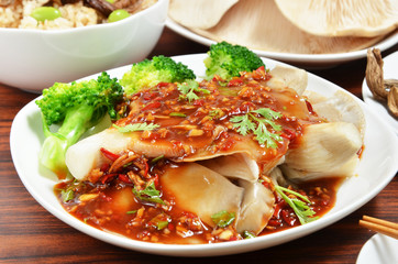 Abalone mushroom with  sauce on white plate