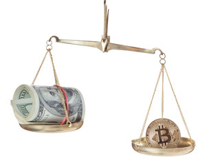 bitcoin and dollars on scales isolated on white background