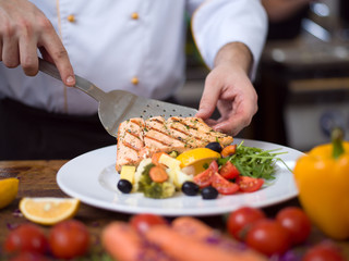 cook chef decorating garnishing prepared meal