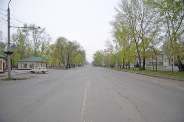 An empty city road, in the early morning.