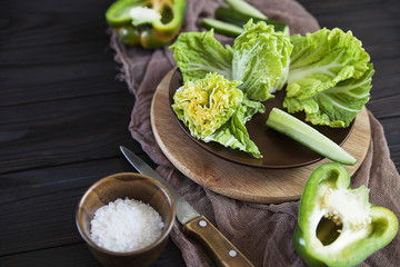 cabbage, green vegetables on a wooden table, Bulgarian green pepper, lettuce, cucumber, diet and detox
