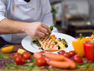 cook chef decorating garnishing prepared meal