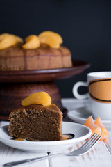 Appetizing pie with tangerines and tasty tea on the table