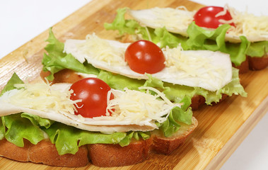 Street food Bruschetta with tomatoes (crispy baguette slices toasted on grill)