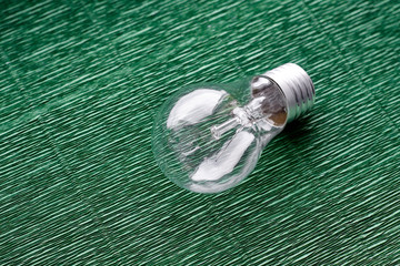 Light bulb on green background. Minimal concept. Copy space