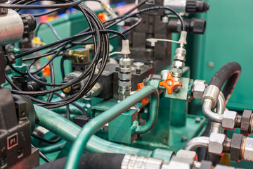 Fototapeta premium Rubber hydraulic hoses, connected to industrial equipment