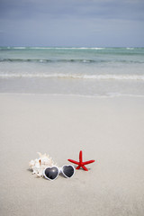Fototapeta na wymiar Summer concept of sandy beach. Summer vacation concept