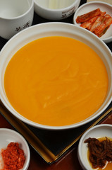 Pumpkin porridge e served with side dish.