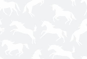 Seamless pattern with white unicorns silhouettes. flat style. isolated on white background
