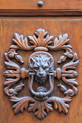 Door knocker in Montalcino town, Val d'Orcia, Tuscany, Italy