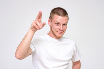 Naklejka premium Portrait of a confident young handsome man on a white background.