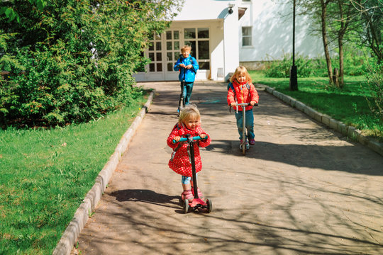 kids coming from school on schooters