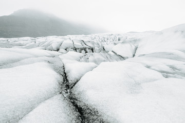 Fototapeta na wymiar Glacier of Skaftafell National Park and people walking on it, Iceland