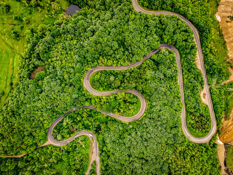 Roads from above extreme winding road in the mountains aerial view