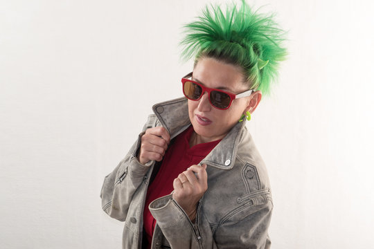 A crazy girl with green hair advertises various styles of glasses. The concept of fun and unexpected advertising.