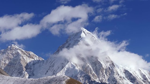 Magnificent view of Pumo Ri peak (7161m) at sunrise. Nepal, Himalaya mountains. Time Lapse.