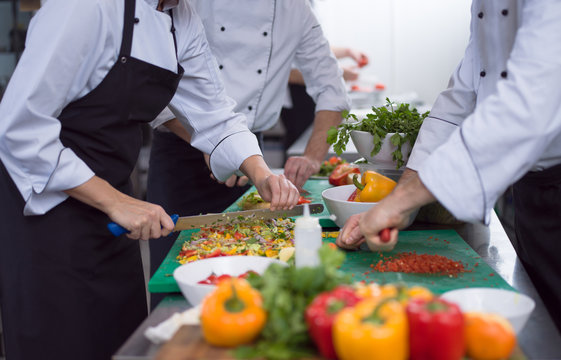 team cooks and chefs preparing meals - Powered by Adobe