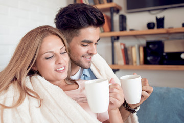 Young couple relaxing on a sofa