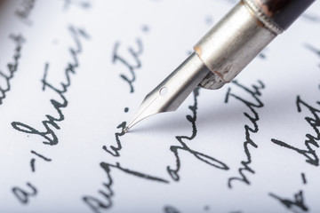 Fototapeta premium Fountain pen on an antique handwritten letter