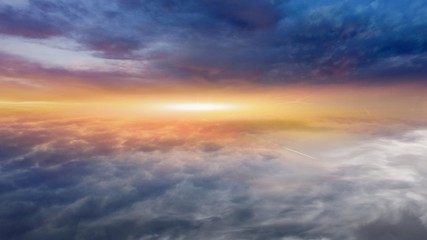 Light from the sun shining through the clouds in the sky . Dramatic nature background .  Sunset or sunrise with clouds, light rays and other atmospheric effect  . Religion background . 