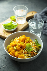 Pumpkin stew with rice and fresh basil