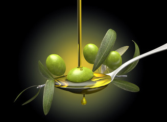 Olive oil jet over a olive branch in a spoon