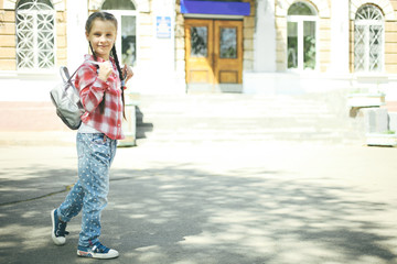 schoolgirl with a schoolbag