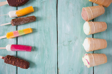Ice cream in waffle cup and popsicles