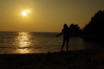 Beautiful sunset with woman on the beach in Japan 