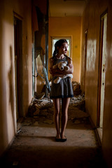 A girl in a gloomy corridor. Apocalypse, war idea