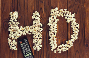 Salt popcorn on the wooden table